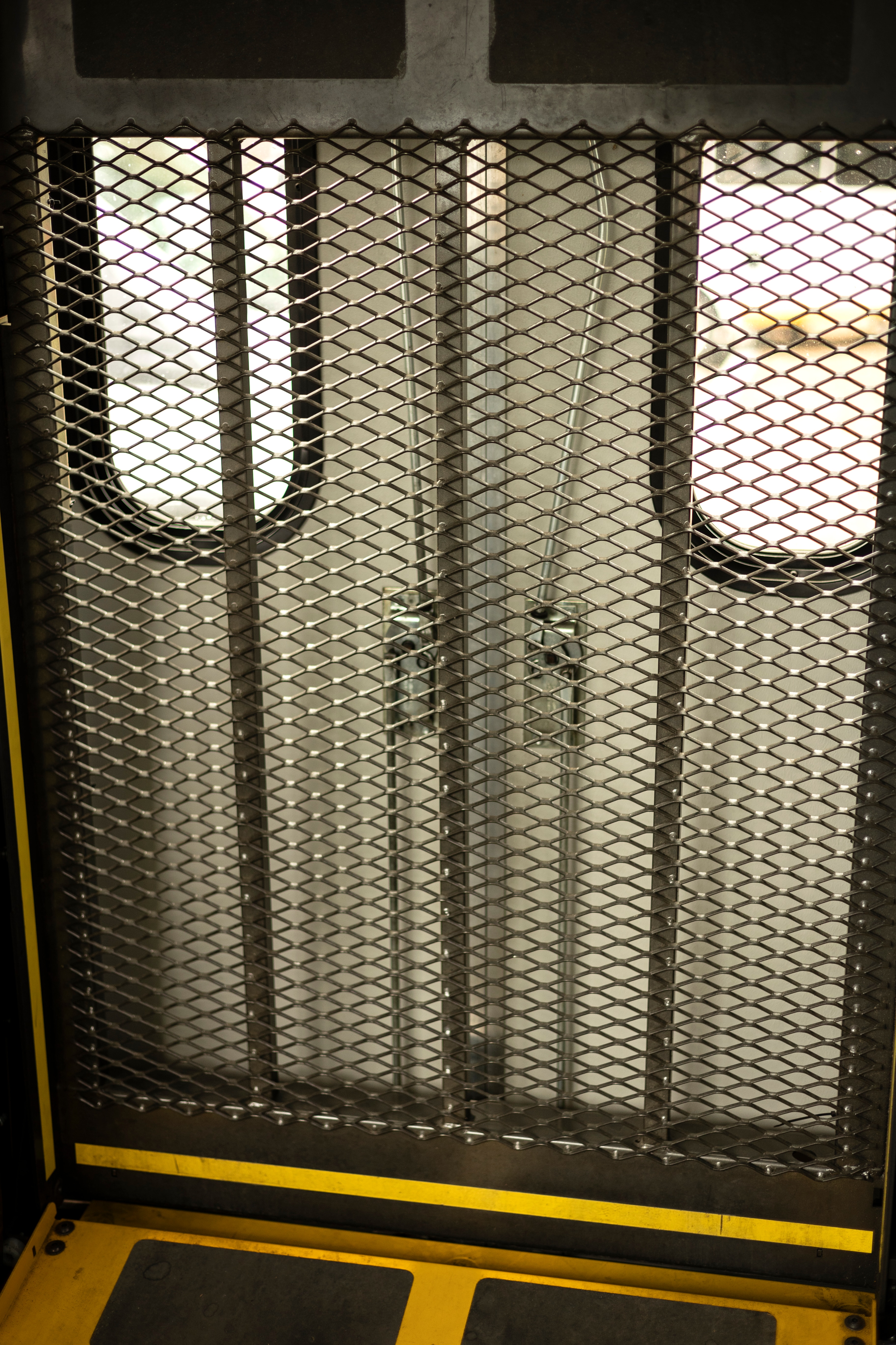 A wheelchair lift is shown in the back of a Ford E-350 cutaway with mobility van upfits.